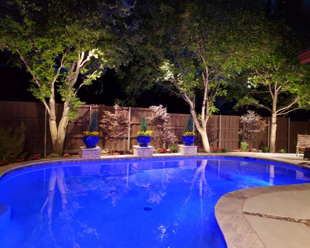 Backyard with custom pool and outdoor lighting