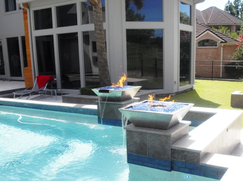 Luxury lienar pool with fire bowls