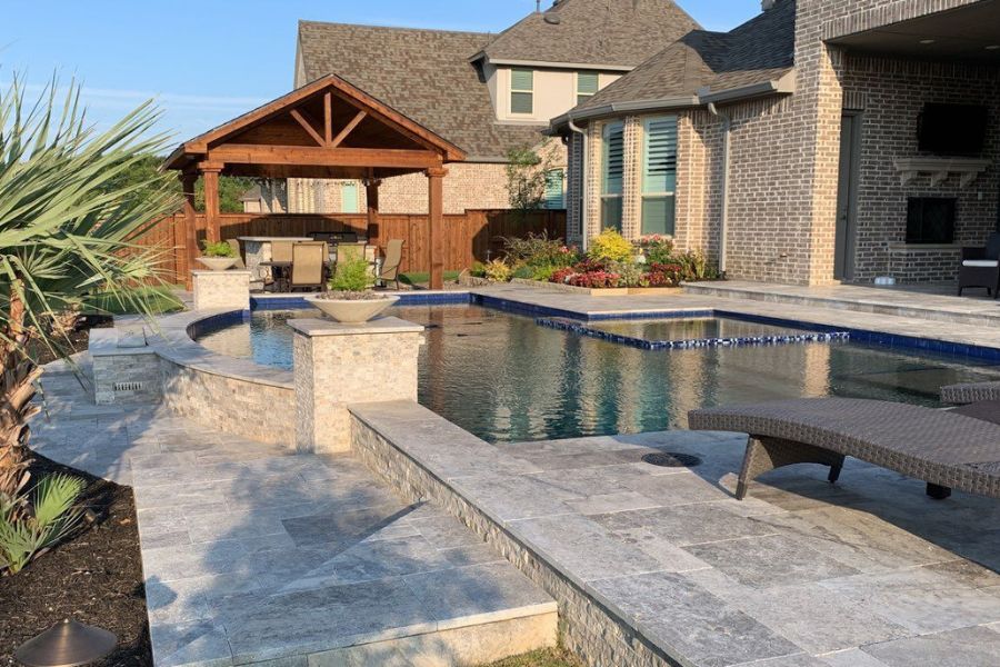 Backyard with custom pool, pergola and outdoor kitchen