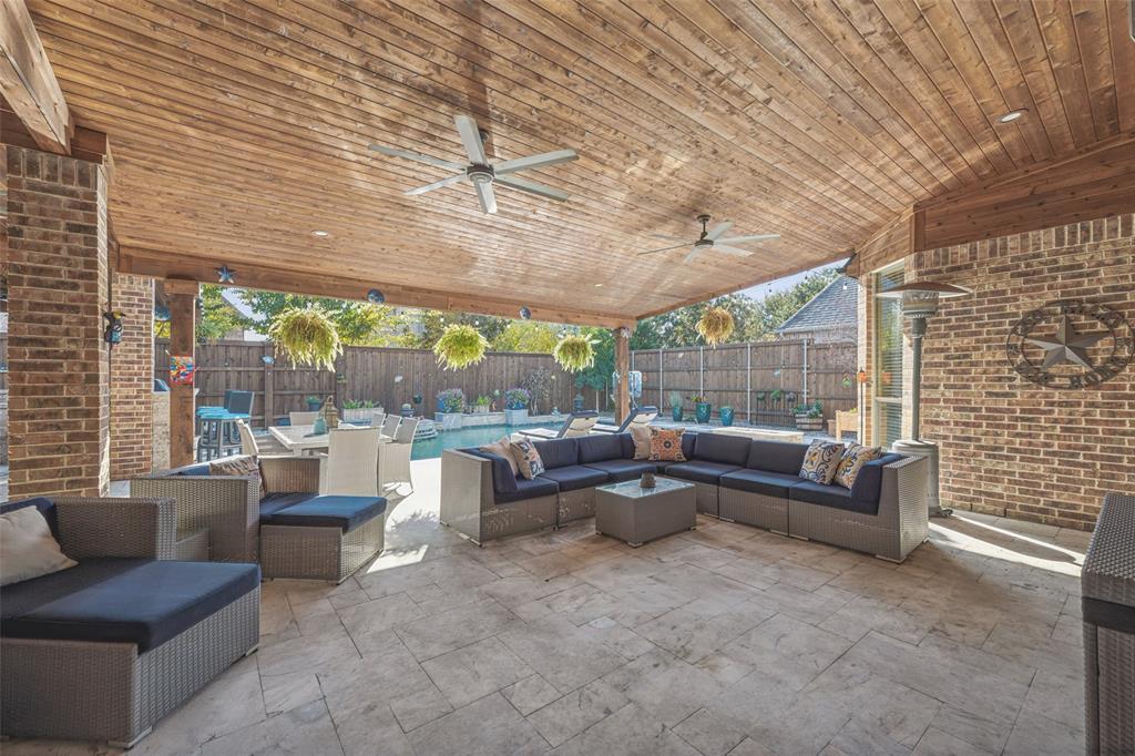 Custom cedar covered patio with lighting and ceiling fan