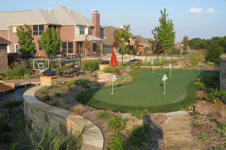 Luxury custom pool with turf and lighting