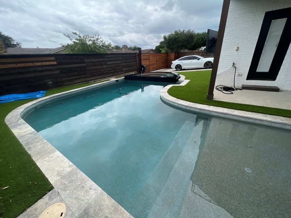 Custom pool remodel with modern coping